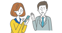 携帯を扱うお客さまにスーツの男性が説明をしているイメージ